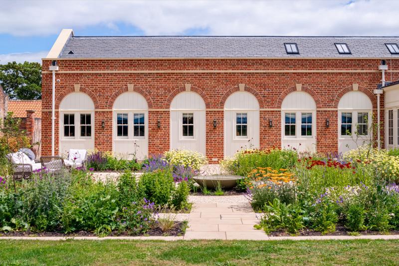 New country house with arch head window openings